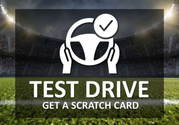 Icon of hands on a steering wheel with text Test Drive, Get a Scratch Card in a stadium.